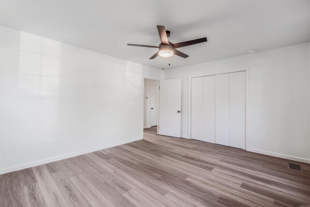 612 Briar St, Sherwood, AR 72120 - unfurnished bedroom with wood finished floors, a closet, baseboards, and a ceiling fan