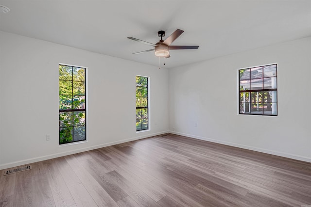 612 Briar St, Sherwood, AR 72120 - unfurnished room with wood finished floors, ceiling fan, and baseboards