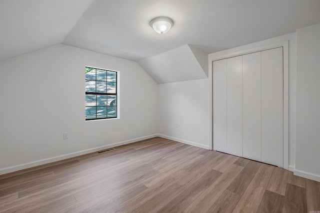 612 Briar St, Sherwood, AR 72120 - additional living space with light wood-style floors, vaulted ceiling, and baseboards