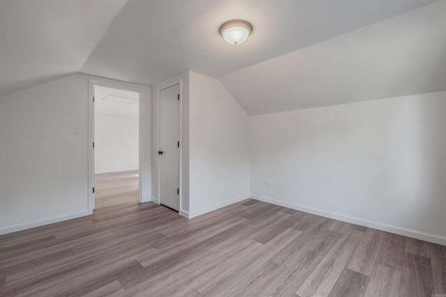 612 Briar St, Sherwood, AR 72120 - bonus room featuring light wood-style floors, lofted ceiling, and baseboards