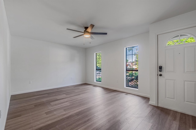 612 Briar St, Sherwood, AR 72120 - foyer entrance featuring wood finished floors, ceiling fan, and baseboards