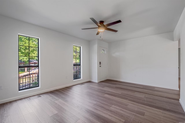 612 Briar St, Sherwood, AR 72120 - spare room with wood finished floors, a ceiling fan, and baseboards