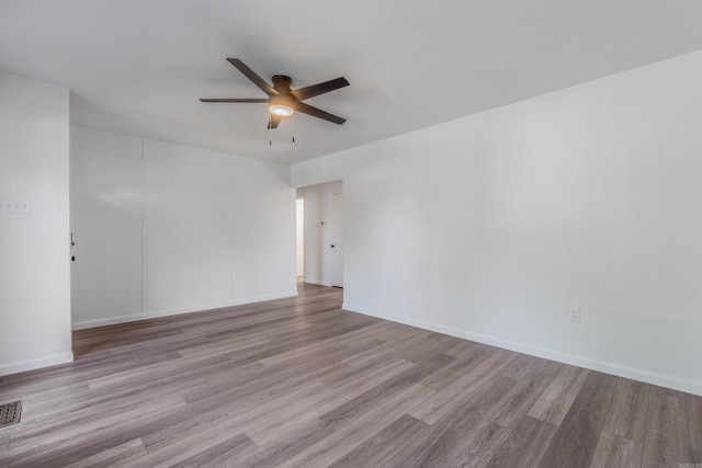 612 Briar St, Sherwood, AR 72120 - empty room with ceiling fan, wood finished floors, and baseboards