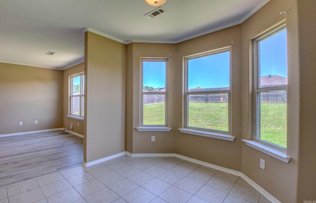 9808 Lanehart Rd, Little Rock, AR 72204 - spare room with ornamental molding, light tile patterned floors, and baseboards