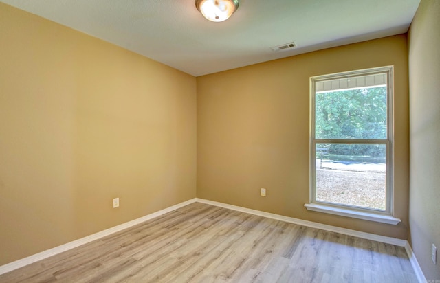 9808 Lanehart Rd, Little Rock, AR 72204 - spare room with light wood-style flooring, healthy amount of natural light, and baseboards