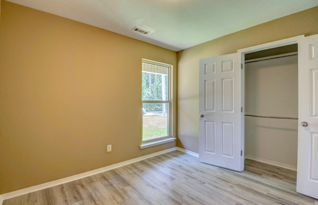 9808 Lanehart Rd, Little Rock, AR 72204 - unfurnished bedroom with light wood-type flooring, baseboards, and a closet