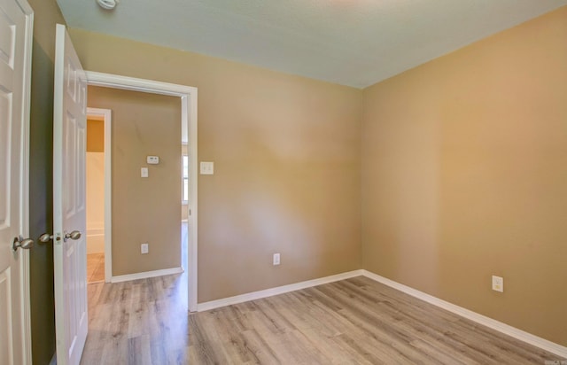 9808 Lanehart Rd, Little Rock, AR 72204 - unfurnished room featuring light wood finished floors, baseboards, and a smoke detector