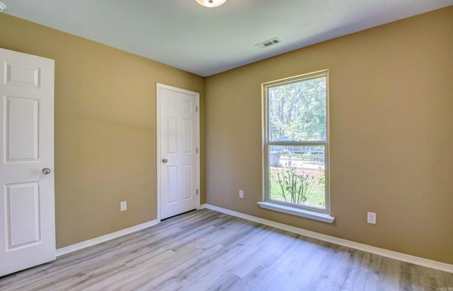 9808 Lanehart Rd, Little Rock, AR 72204 - unfurnished bedroom featuring wood finished floors and baseboards