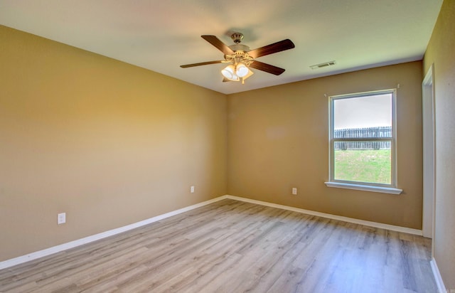 9808 Lanehart Rd, Little Rock, AR 72204 - unfurnished room with light wood-style flooring, ceiling fan, and baseboards