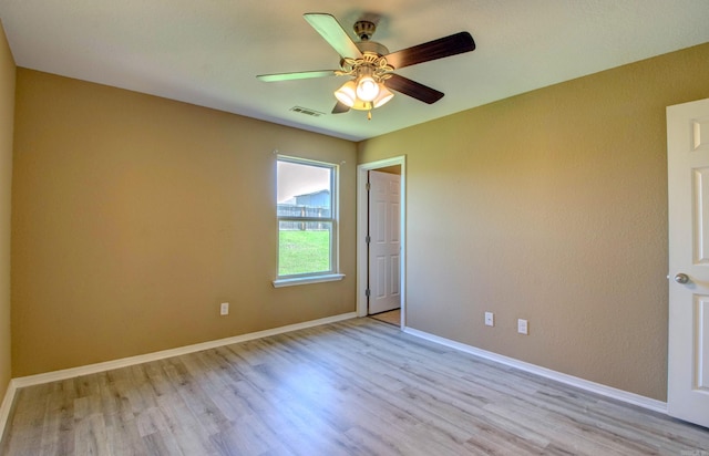 9808 Lanehart Rd, Little Rock, AR 72204 - empty room featuring light wood-style floors, a ceiling fan, and baseboards