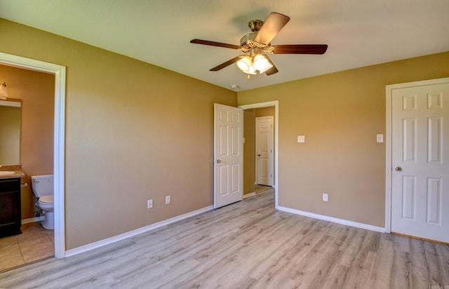 9808 Lanehart Rd, Little Rock, AR 72204 - unfurnished bedroom featuring light wood-style floors, baseboards, connected bathroom, and ceiling fan