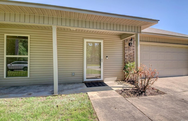 9808 Lanehart Rd, Little Rock, AR 72204 - property entrance with a garage and concrete driveway