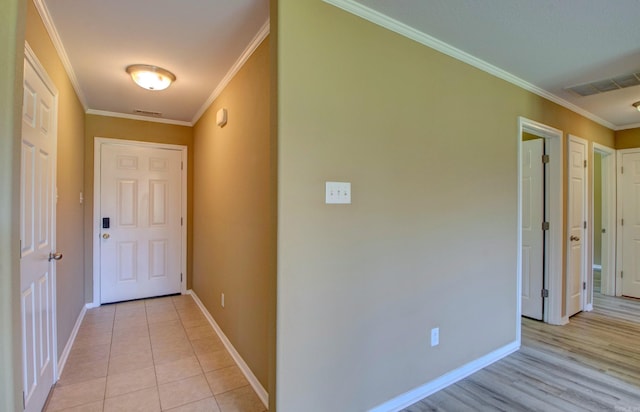 9808 Lanehart Rd, Little Rock, AR 72204 - hall featuring crown molding, baseboards, and light tile patterned floors