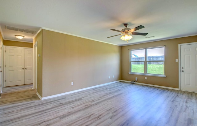9808 Lanehart Rd, Little Rock, AR 72204 - empty room featuring crown molding, light wood-style floors, ceiling fan, and baseboards