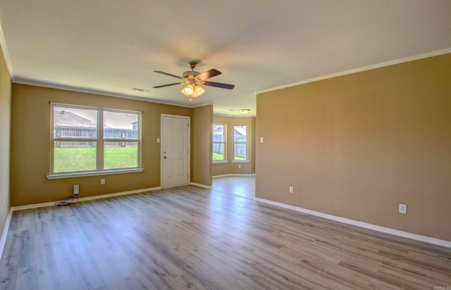 9808 Lanehart Rd, Little Rock, AR 72204 - empty room featuring ceiling fan, wood finished floors, baseboards, and crown molding