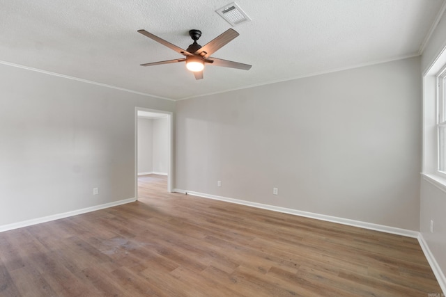 118 Blair St, Searcy, AR 72143 - unfurnished room with a ceiling fan, wood finished floors, baseboards, ornamental molding, and a textured ceiling