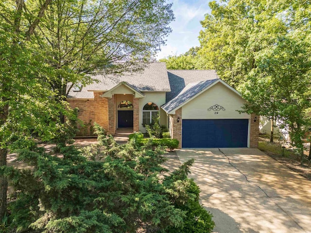 29 Barcelona Way, Hot Springs Village, AR 71909 - view of front of home with brick siding, concrete driveway, and a garage