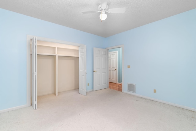 29 Barcelona Way, Hot Springs Village, AR 71909 - unfurnished bedroom with carpet floors, baseboards, a closet, ceiling fan, and a textured ceiling