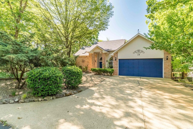 29 Barcelona Way, Hot Springs Village, AR 71909 - view of front of home with brick siding, a garage, and driveway