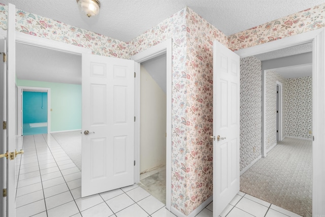 29 Barcelona Way, Hot Springs Village, AR 71909 - bathroom with a textured ceiling, wallpapered walls, and tile patterned flooring