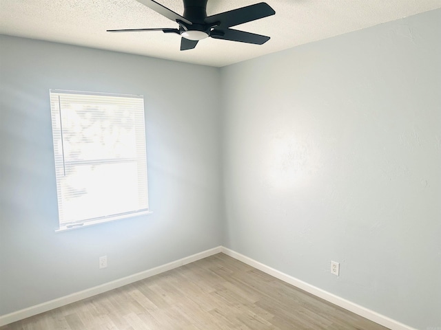 8312 Walkers Dr, North Little Rock, AR 72117 - spare room with light wood-style flooring, a ceiling fan, baseboards, and a textured ceiling