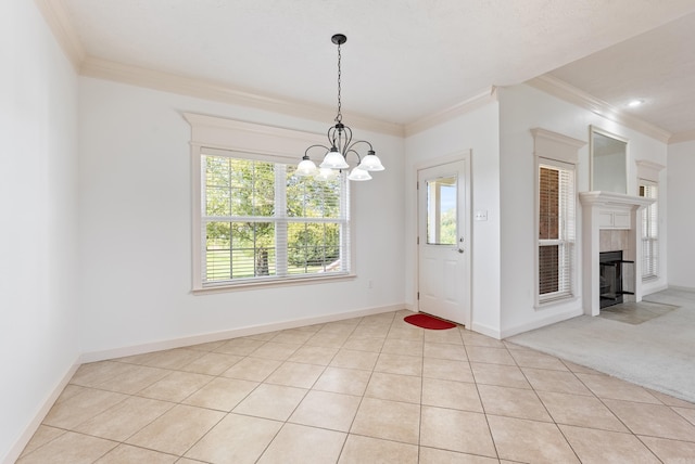 6 Donnie Cv, Greenbrier, AR 72058 - unfurnished dining area featuring crown molding, a chandelier, a tile fireplace, baseboards, and light tile patterned floors