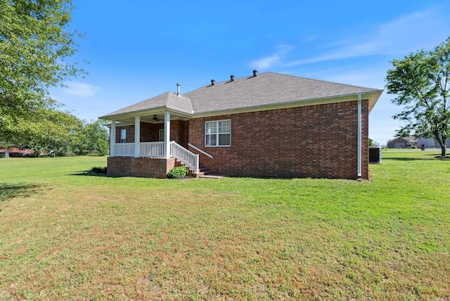 6 Donnie Cv, Greenbrier, AR 72058 - rear view of property featuring ceiling fan, a lawn, and brick siding