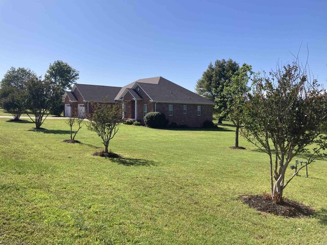 6 Donnie Cv, Greenbrier, AR 72058 - view of green lawn featuring an attached garage