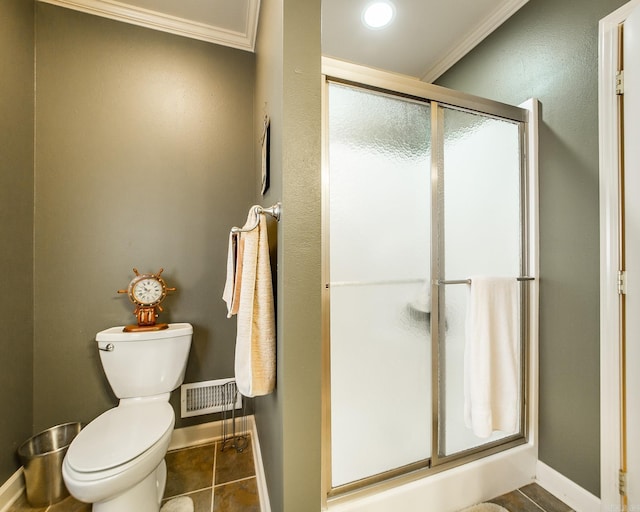 389 Tortoise Bay Rd, Higden, AR 72067 - bathroom featuring ornamental molding, toilet, a shower stall, baseboards, and tile patterned floors