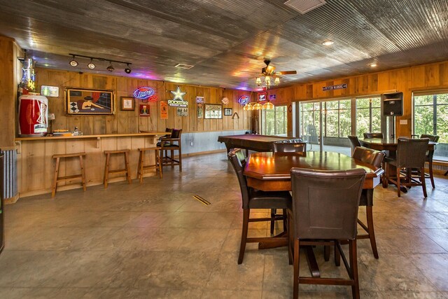 389 Tortoise Bay Rd, Higden, AR 72067 - dining space featuring wooden walls, ceiling fan, billiards table, track lighting, and baseboards