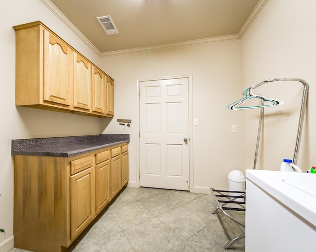 389 Tortoise Bay Rd, Higden, AR 72067 - laundry room featuring cabinet space, crown molding, baseboards, and light tile patterned floors