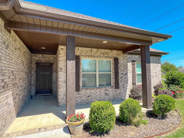 11 Shadow Creek Dr, Austin, AR 72007 - doorway to property featuring brick siding and a porch
