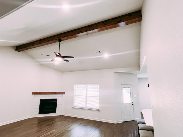 11 Shadow Creek Dr, Austin, AR 72007 - unfurnished living room featuring dark wood finished floors, beam ceiling, a ceiling fan, baseboards, and a fireplace