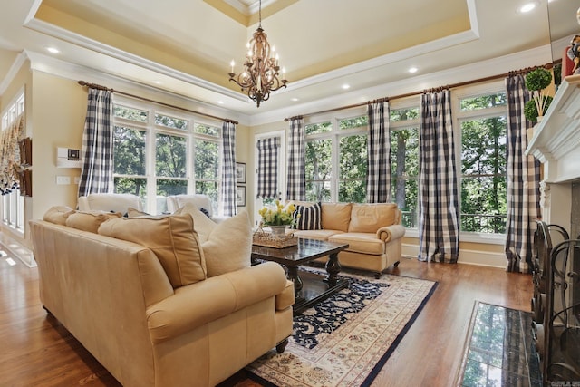 4 Dressage Ct, Little Rock, AR 72223 - living room with a tray ceiling, ornamental molding, a chandelier, wood finished floors, and recessed lighting
