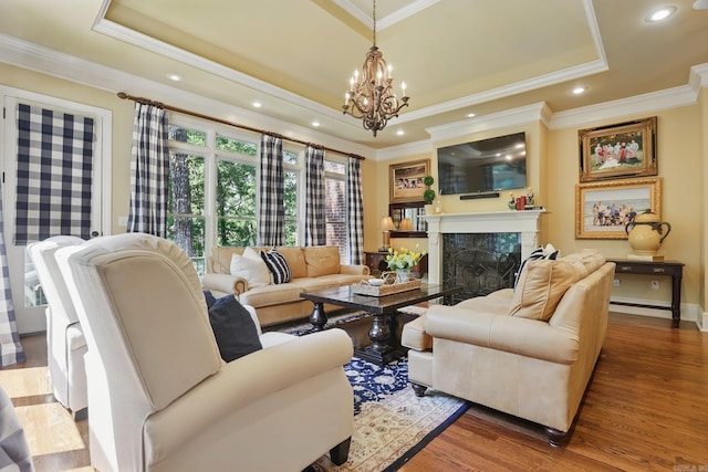 4 Dressage Ct, Little Rock, AR 72223 - living area featuring a raised ceiling, crown molding, a fireplace, wood finished floors, and recessed lighting