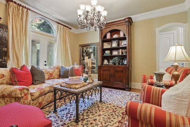 4 Dressage Ct, Little Rock, AR 72223 - living area with arched walkways, a chandelier, french doors, wood finished floors, and crown molding