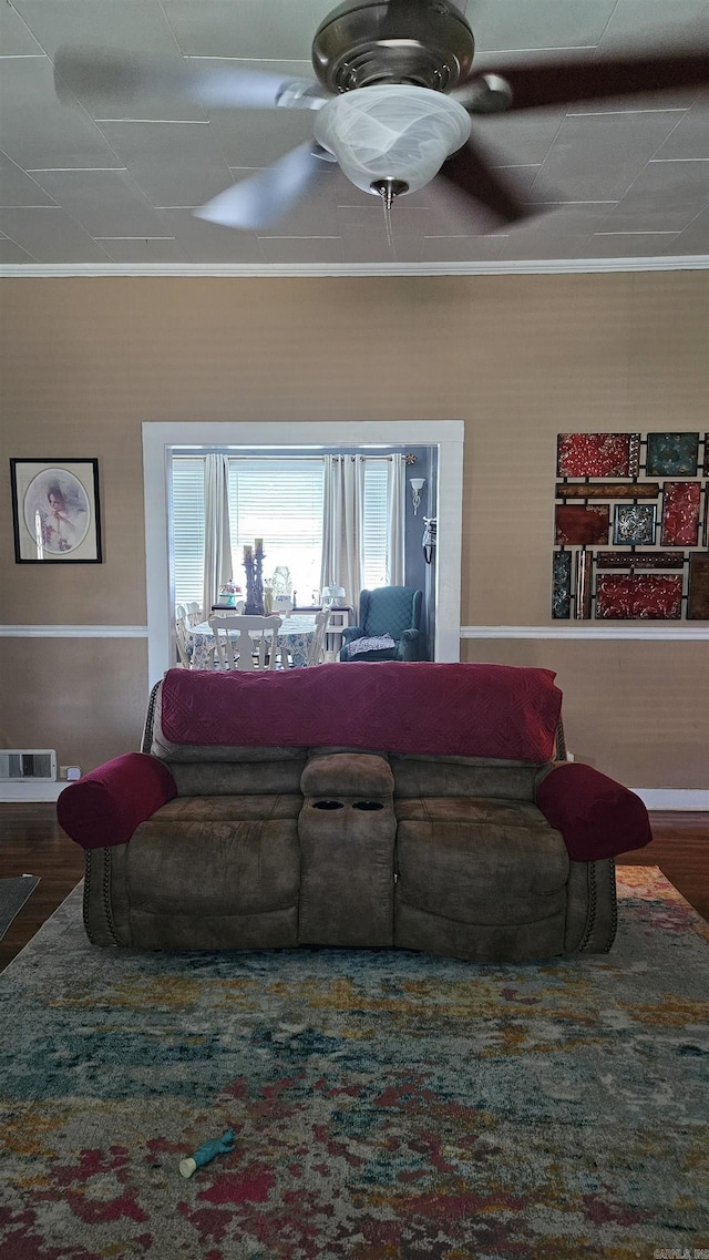 620 W 3rd St, Rector, AR 72461 - living area featuring wood finished floors, a ceiling fan, and ornamental molding