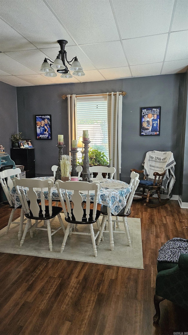 620 W 3rd St, Rector, AR 72461 - dining space featuring a drop ceiling and wood finished floors