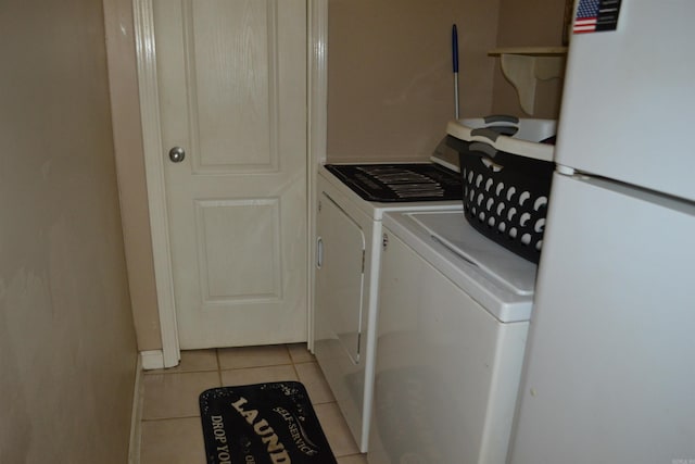 423 W Saint Louis St, Hot Springs, AR 71913 - washroom featuring washing machine and dryer and light tile patterned floors