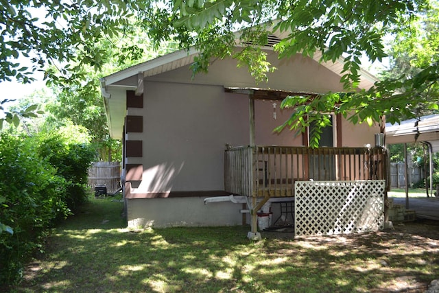 423 W Saint Louis St, Hot Springs, AR 71913 - view of side of home featuring a deck and stucco siding