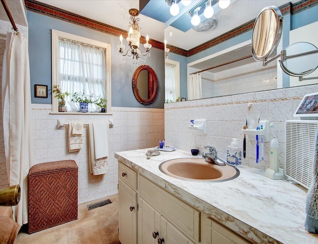 190 Woodlore Pt, Hot Springs, AR 71913 - bathroom featuring tile walls, a chandelier, vanity, a wainscoted wall, and crown molding