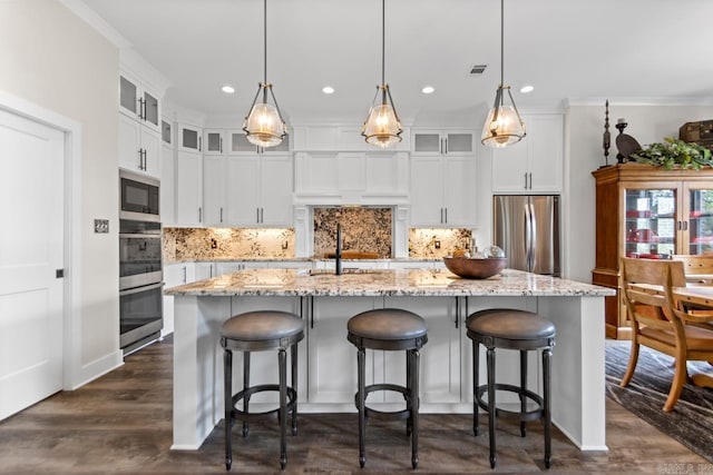 6020 Centark Ct, Alexander, AR 72002 - kitchen with appliances with stainless steel finishes, recessed lighting, a sink, a kitchen island with sink, and dark wood-type flooring