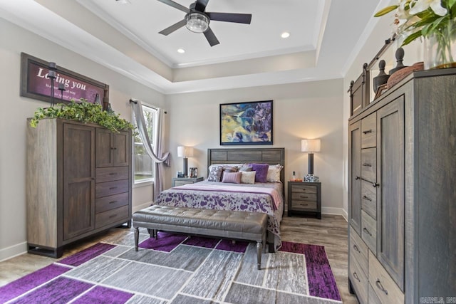 6020 Centark Ct, Alexander, AR 72002 - bedroom featuring wood finished floors, baseboards, a raised ceiling, recessed lighting, and ceiling fan
