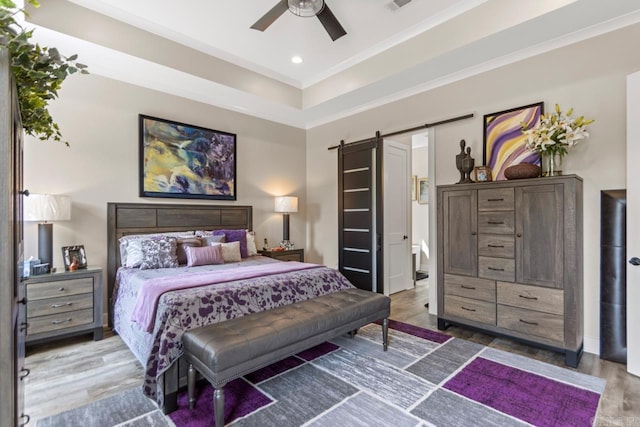 6020 Centark Ct, Alexander, AR 72002 - bedroom with a barn door, wood finished floors, crown molding, recessed lighting, and ceiling fan