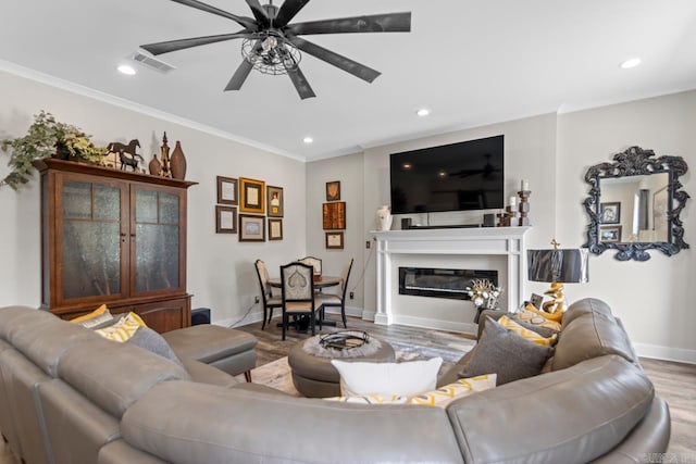 6020 Centark Ct, Alexander, AR 72002 - living room featuring wood finished floors, recessed lighting, ornamental molding, baseboards, and a ceiling fan