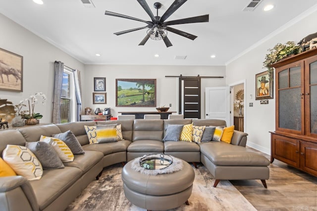 6020 Centark Ct, Alexander, AR 72002 - living room with a barn door, ceiling fan, wood finished floors, crown molding, and recessed lighting