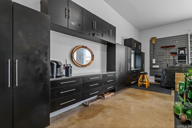 6020 Centark Ct, Alexander, AR 72002 - kitchen with dark cabinetry, concrete floors, freestanding refrigerator, and light countertops