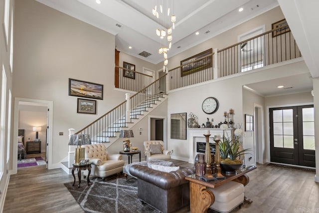 6020 Centark Ct, Alexander, AR 72002 - living area featuring a high ceiling, stairs, wood finished floors, baseboards, and recessed lighting
