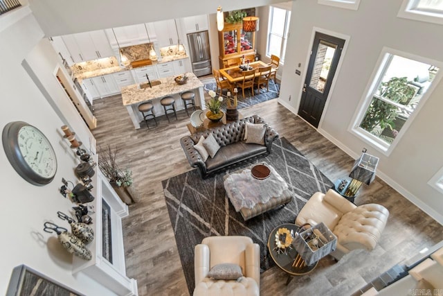 6020 Centark Ct, Alexander, AR 72002 - living room with dark wood-style floors, healthy amount of natural light, and baseboards