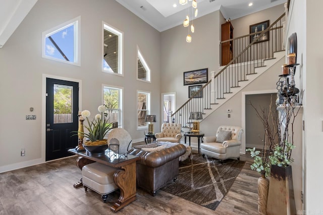 6020 Centark Ct, Alexander, AR 72002 - living room with stairway, wood finished floors, baseboards, a high ceiling, and ornamental molding